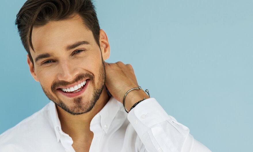 man smiling after straightening teeth
