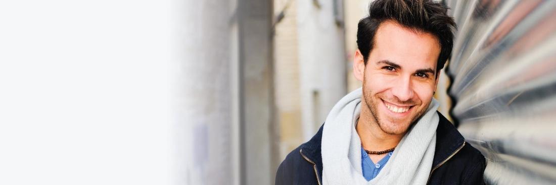 Man smiling after Laser gum surgery at Central Park Dental Clinic