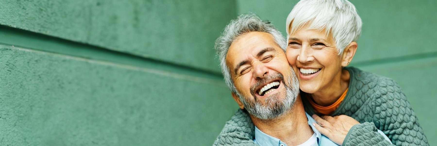 an elderly couple after getting Partial Dentures in Burnaby, BC