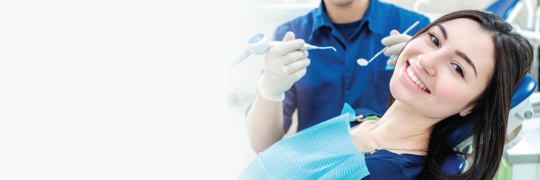 Lady smiling during dental examination in Burnaby, BC