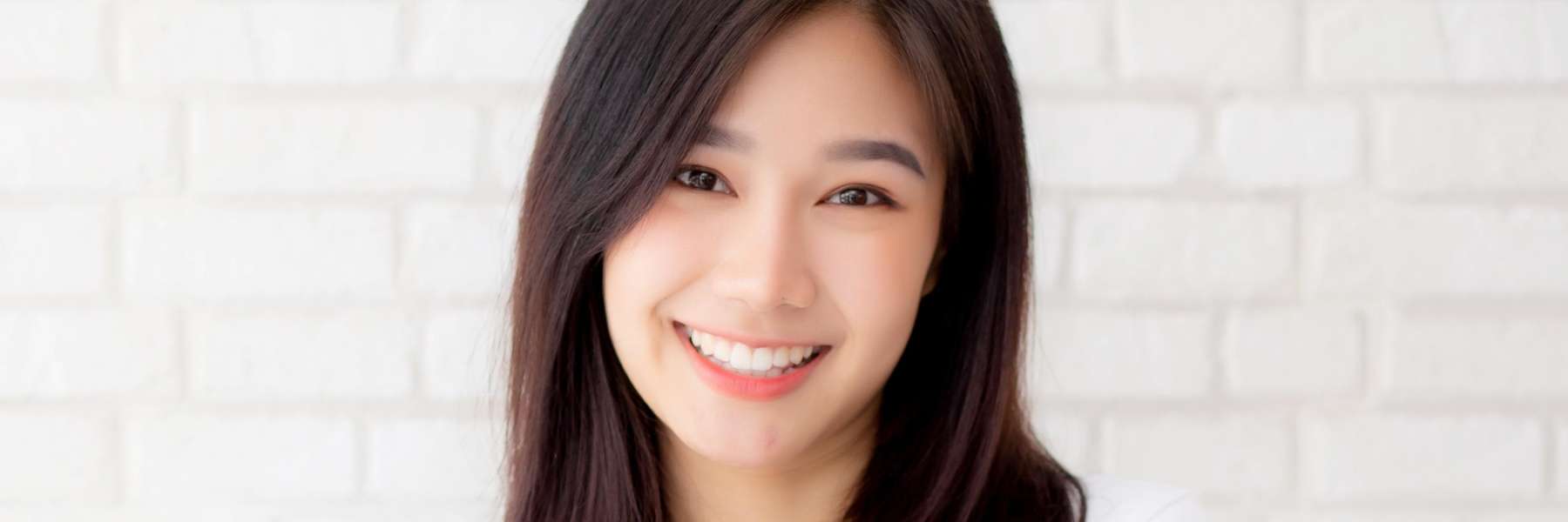 Happy lady after tooth extraction at Central Park Dental cliniic