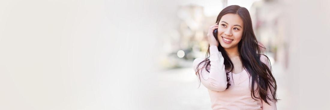 Woman poses for a photo after dental treatment at Central Park Dental Clinic