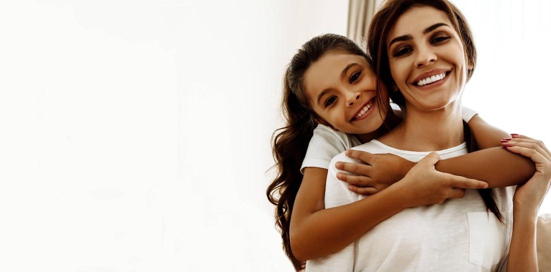 Mother and daughter smiling after dental check up at Central Park Dental Clinic