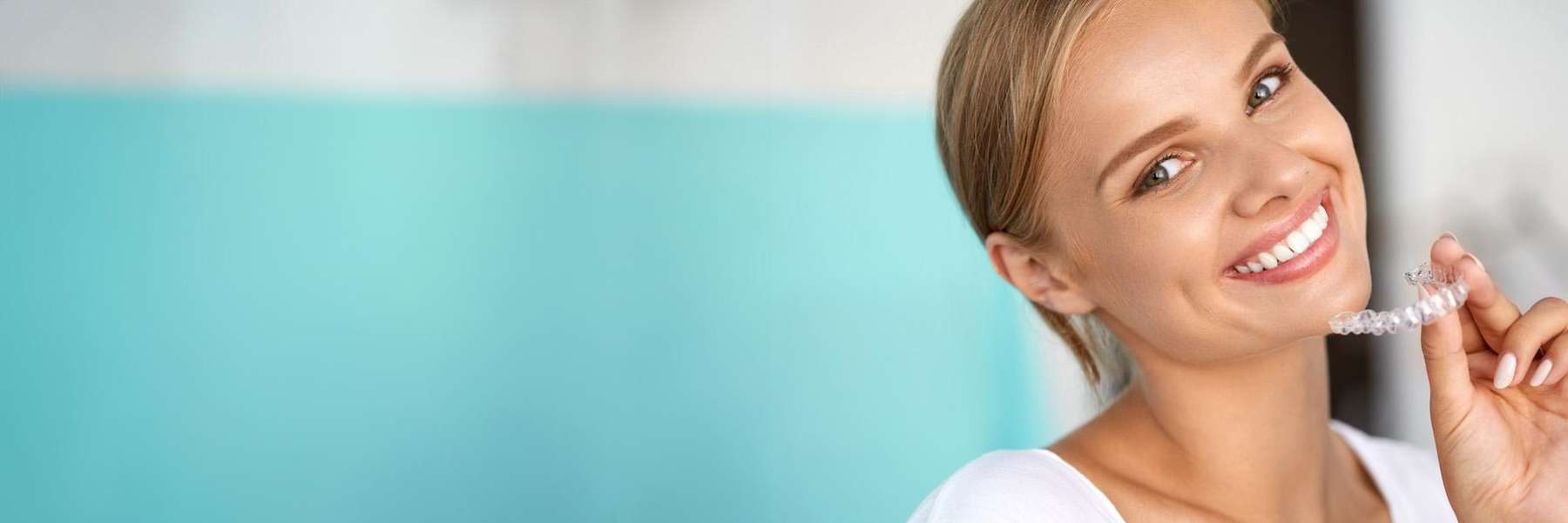 a lady with Invisalign clear aligners in Burnaby