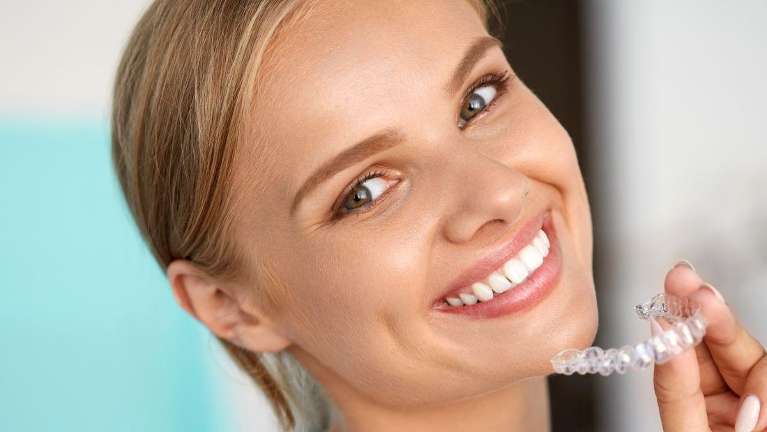 A happy lady with Invisalign in Burnaby, BC