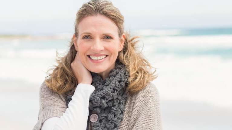 A woman smiling after getting a botox in Burnaby, BC