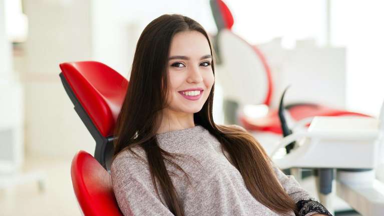 Lady relaxing after dental check up at Central Park Dental Clinic