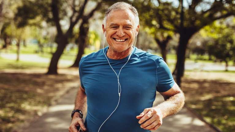 Man jogging happily after tooth extraction in Kingsway, Burnaby
