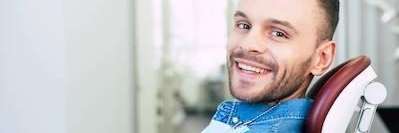 Man smiling after tooth extraction at Central Park Dental Clinic