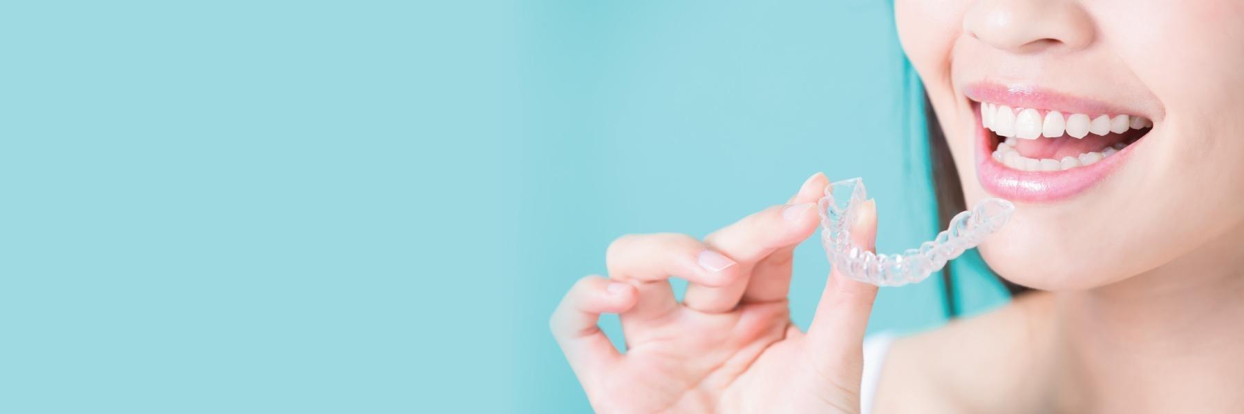 Close up of woman using Clear aligners