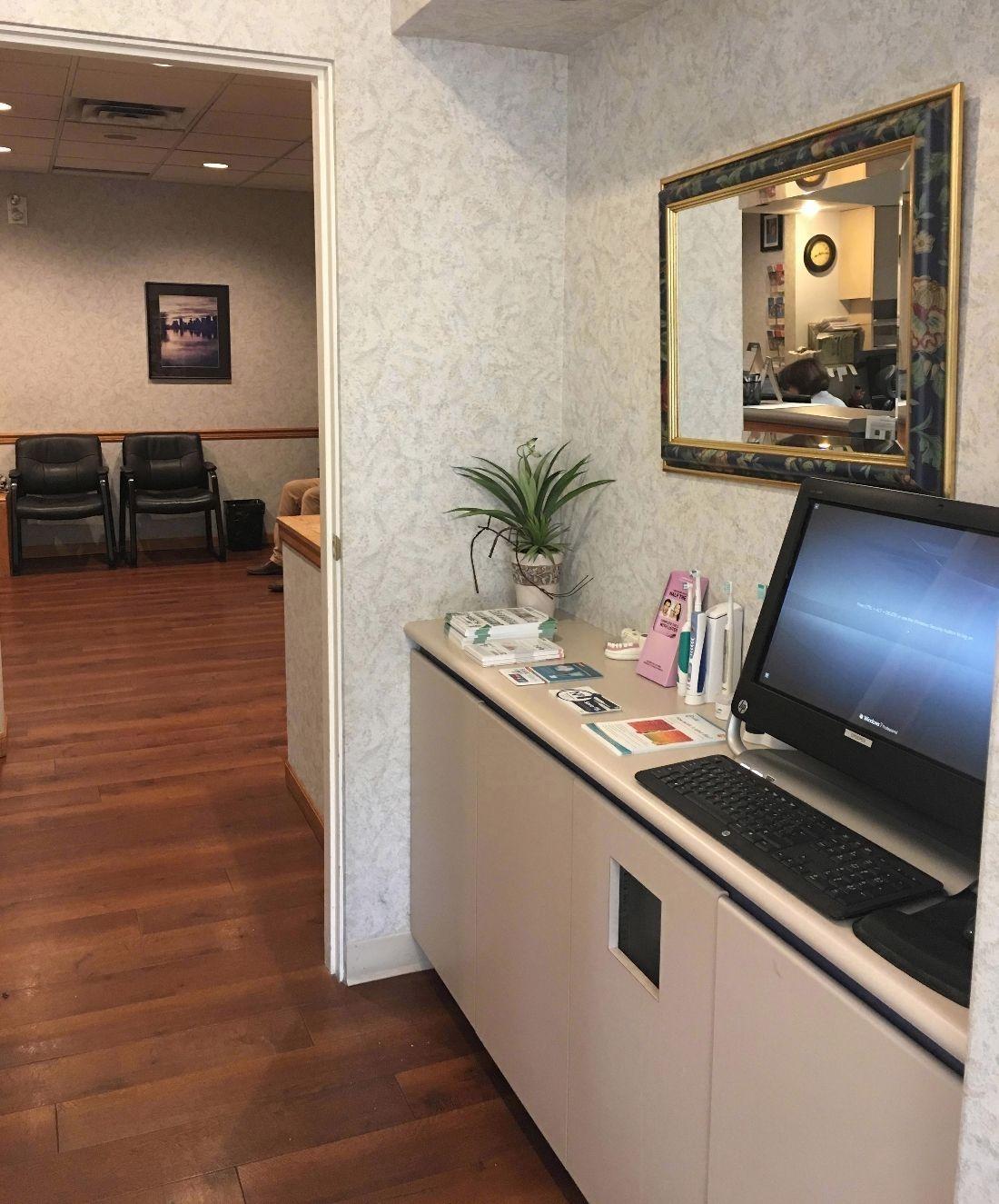 Hallway in Central Park Dental Clinic with computer 